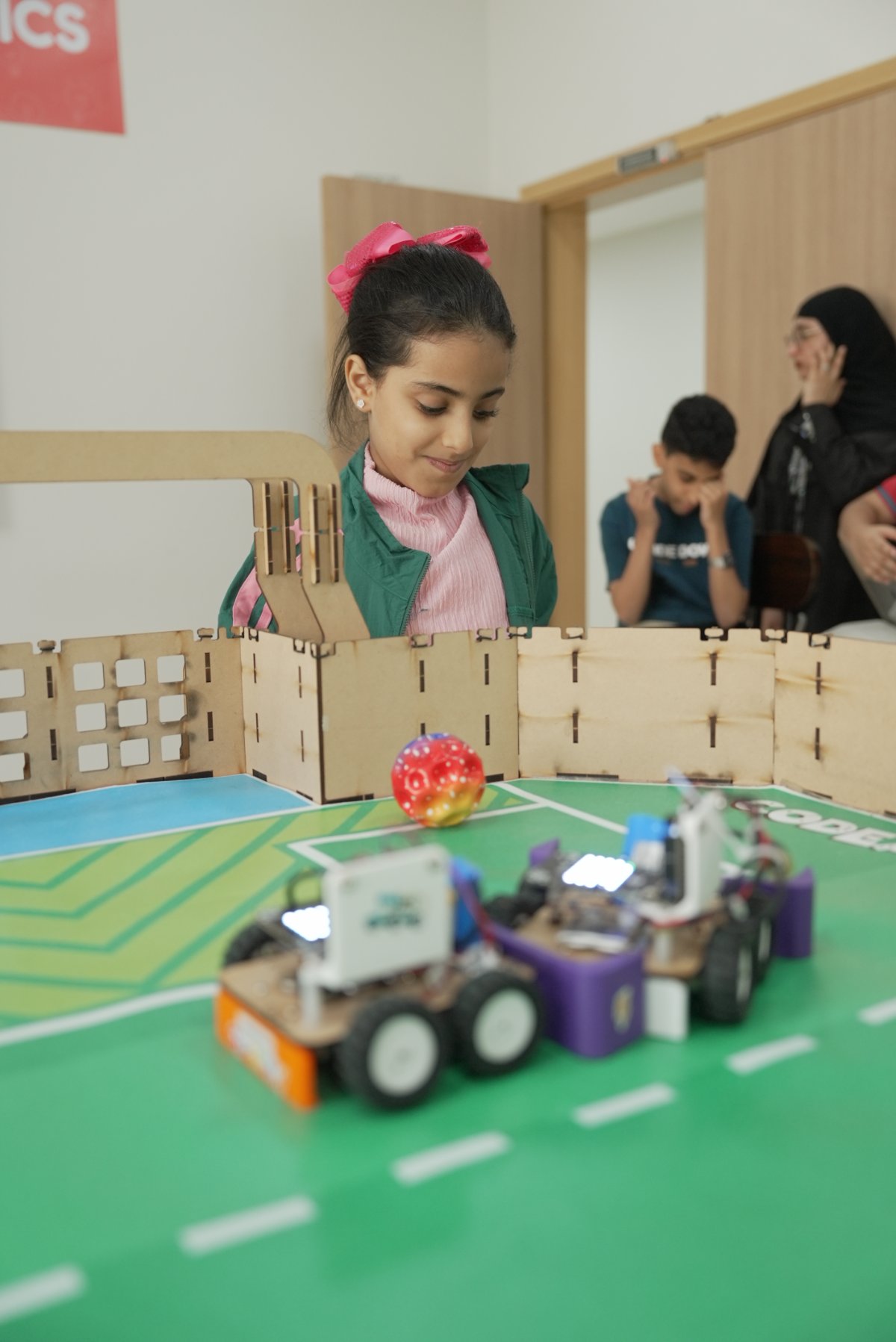 Student competing in the robot arena